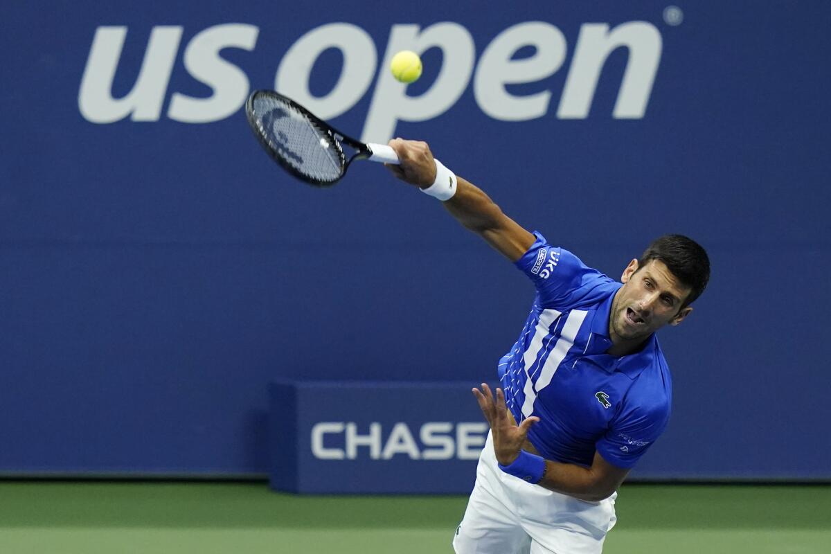 Novak Djokovic serves during a third-round match at the 2020 U.S. Open.