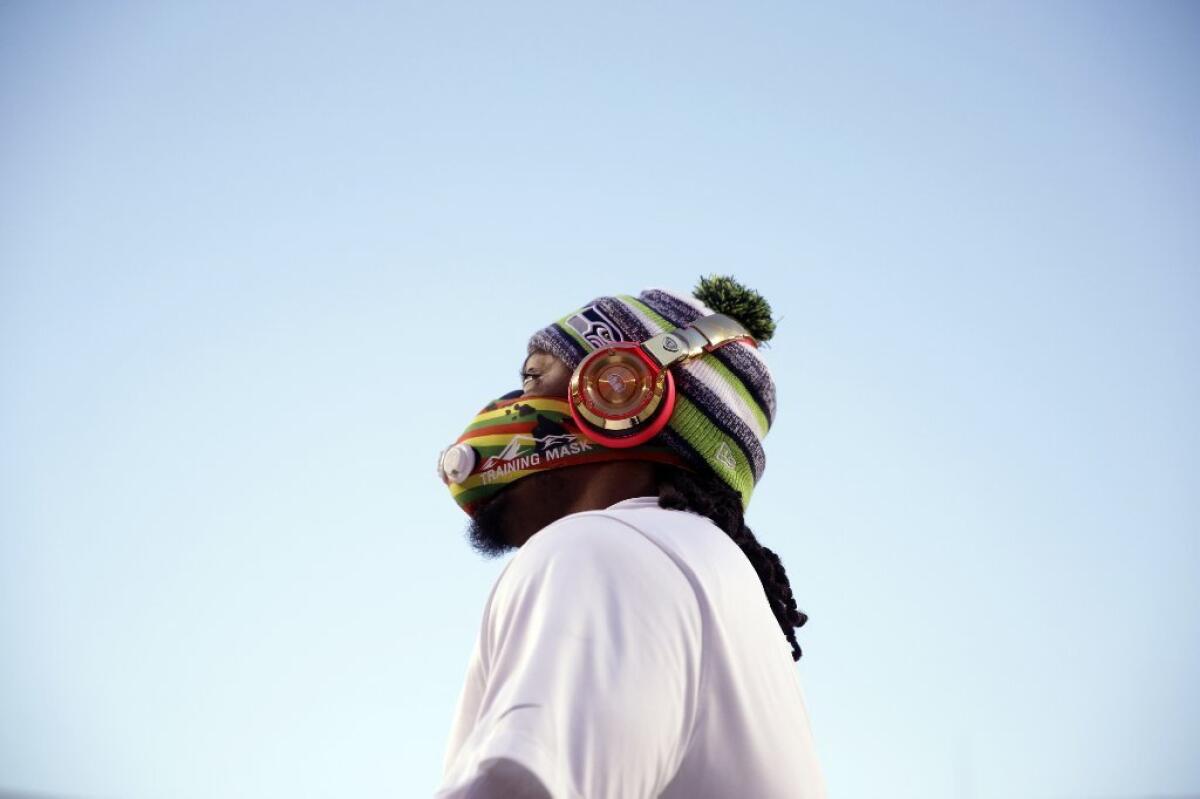 Marshawn Lynch wears a high-altitude training mask before the start of Seahawks' Monday night game against the Redskins.