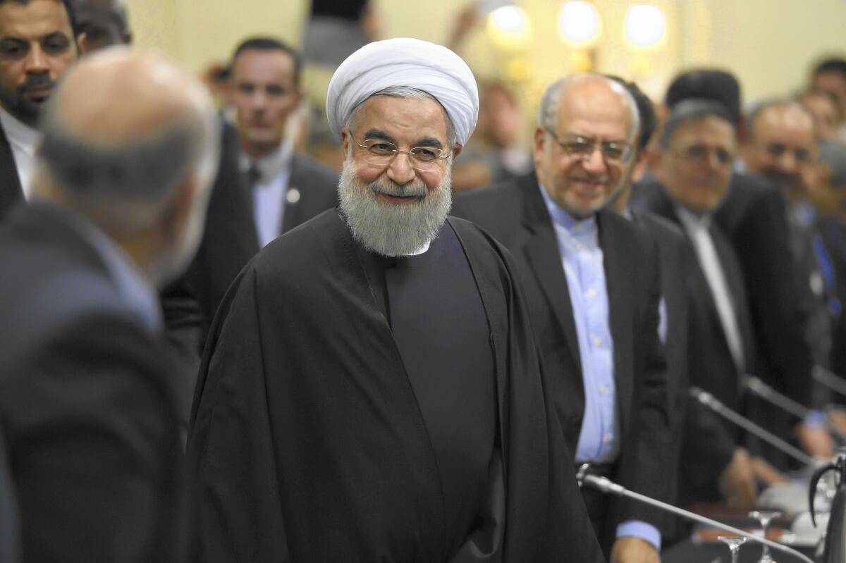 Iranian President Hassan Rouhani, second from left, meets with business leaders in Paris.