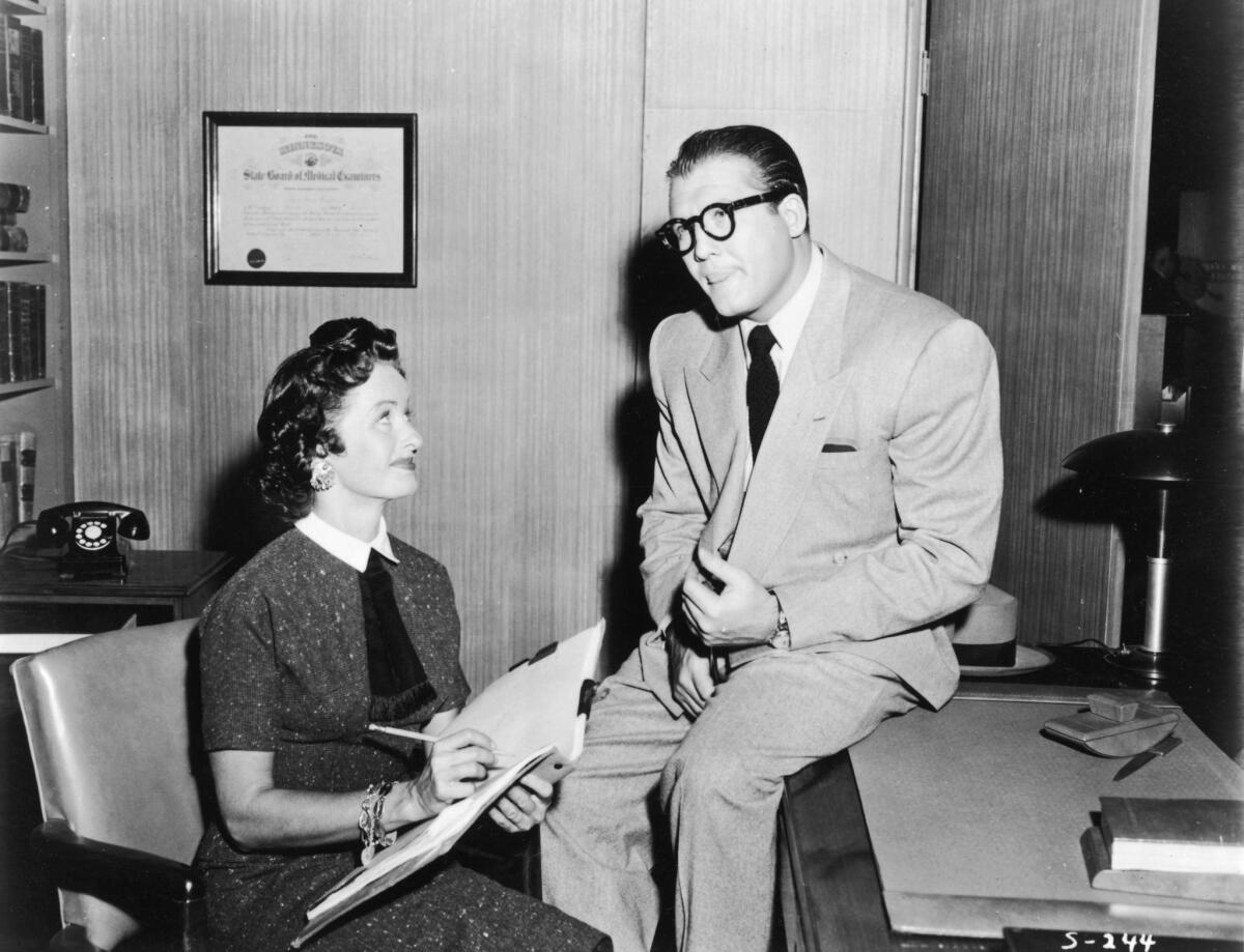 Noel Neill, pictured with George Reeves in a still from the television series "Adventures of Superman," circa 1955, died at her home in Arizona. She was 95.