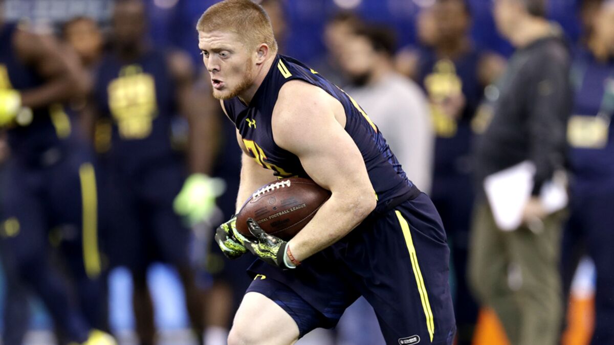 Virginia Tech running back Sam Rogers performs a drill at the NFL combine in March.