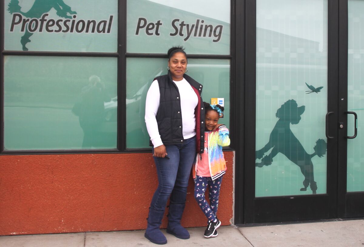 Lena Swann, owner of All About the Dogue grooming studio in Emeryville, with  daughter Caliana.