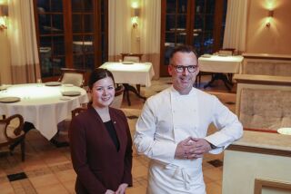 New wine director Victoria O'Bryan (left) and Chef William Bradley pose for photos in the newly remodeled dinning area at Addison on January 29, 2020 in San Diego, California.