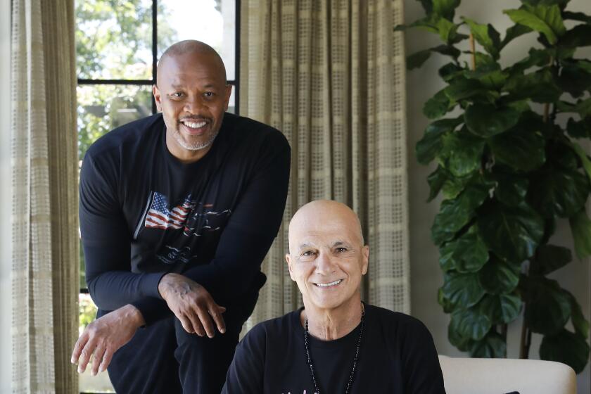 Dr. Dre, left, and Jimmy Iovine, are photographed at Dr. Dre's home in Los Angeles on Friday, June 11, 2021.