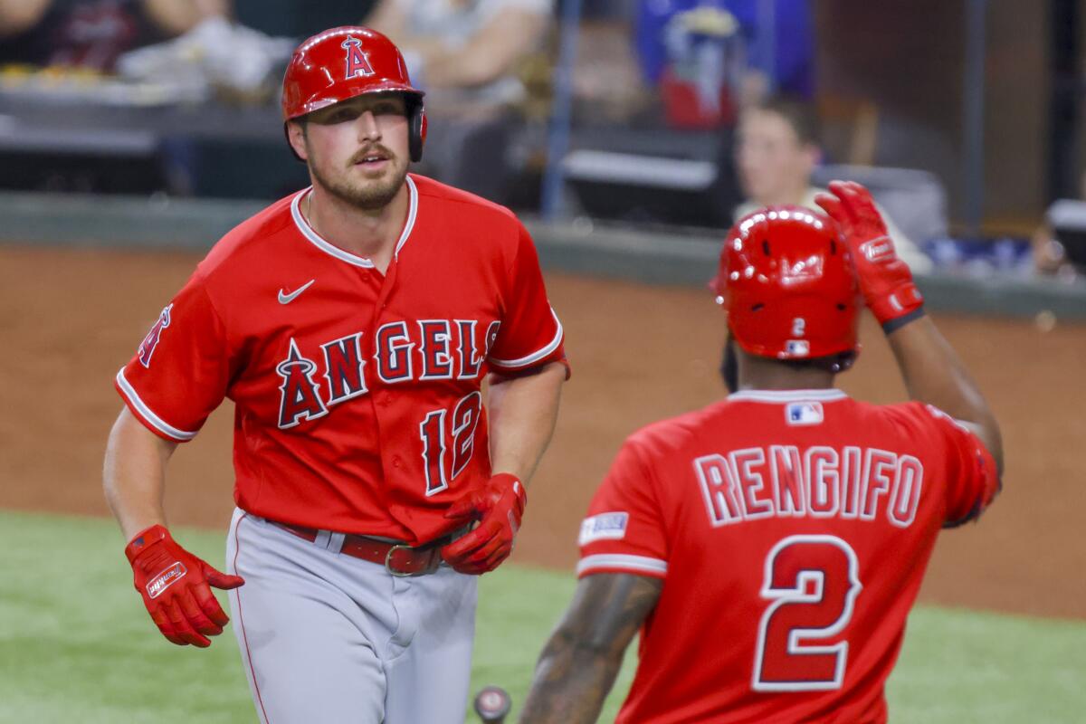 The Angels' Hunter Renfroe and Luis Rengifo celebrate after Renfroe hit a homer against the Texas Rangers on June 13, 2023.