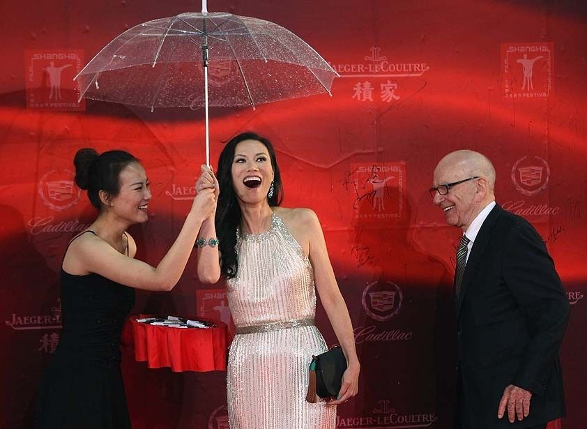 Rupert Murdoch and Wendi Deng, center, arrive at the opening ceremony of the Shanghai International Film Festival.