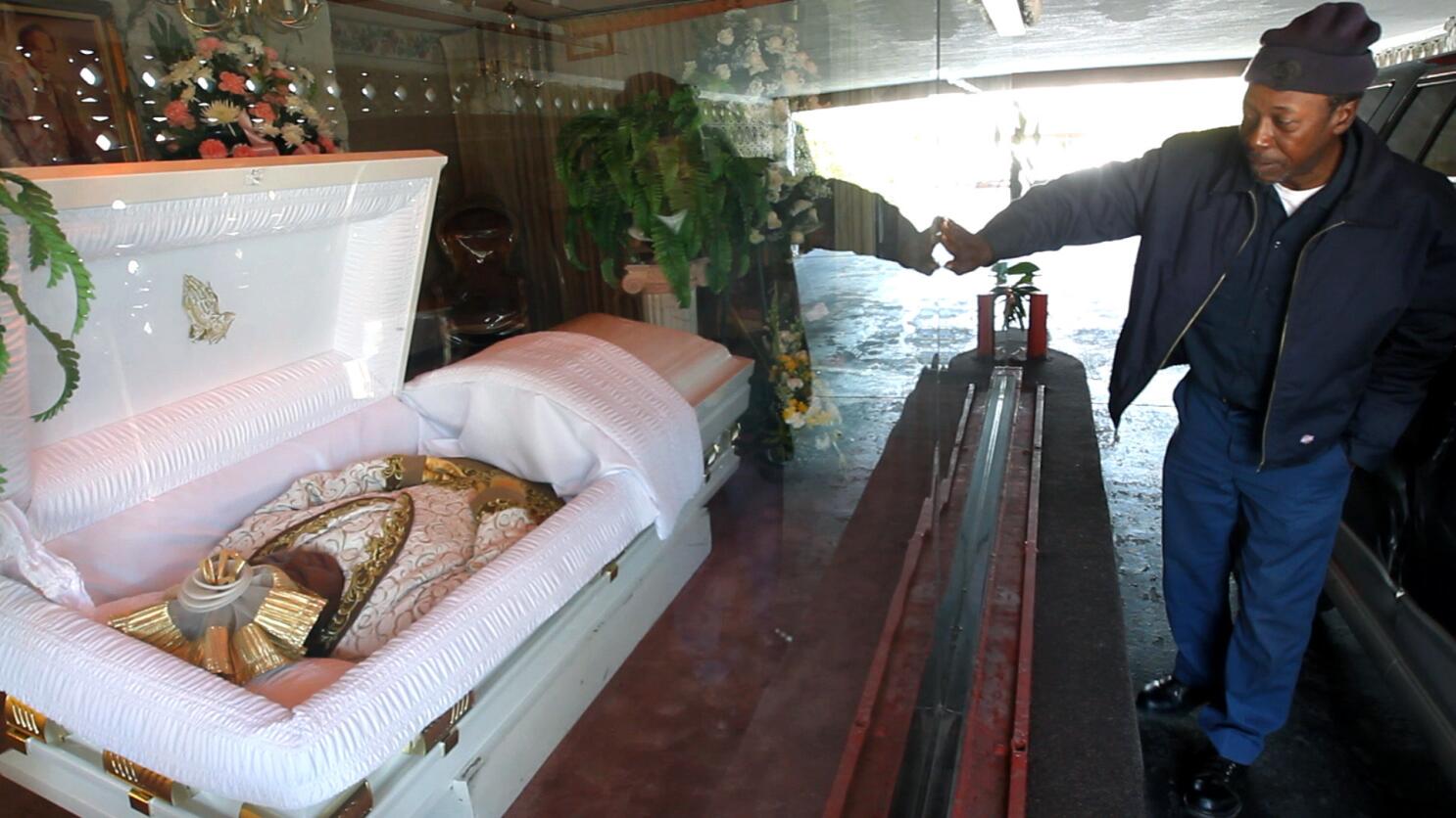 famous people lying in casket