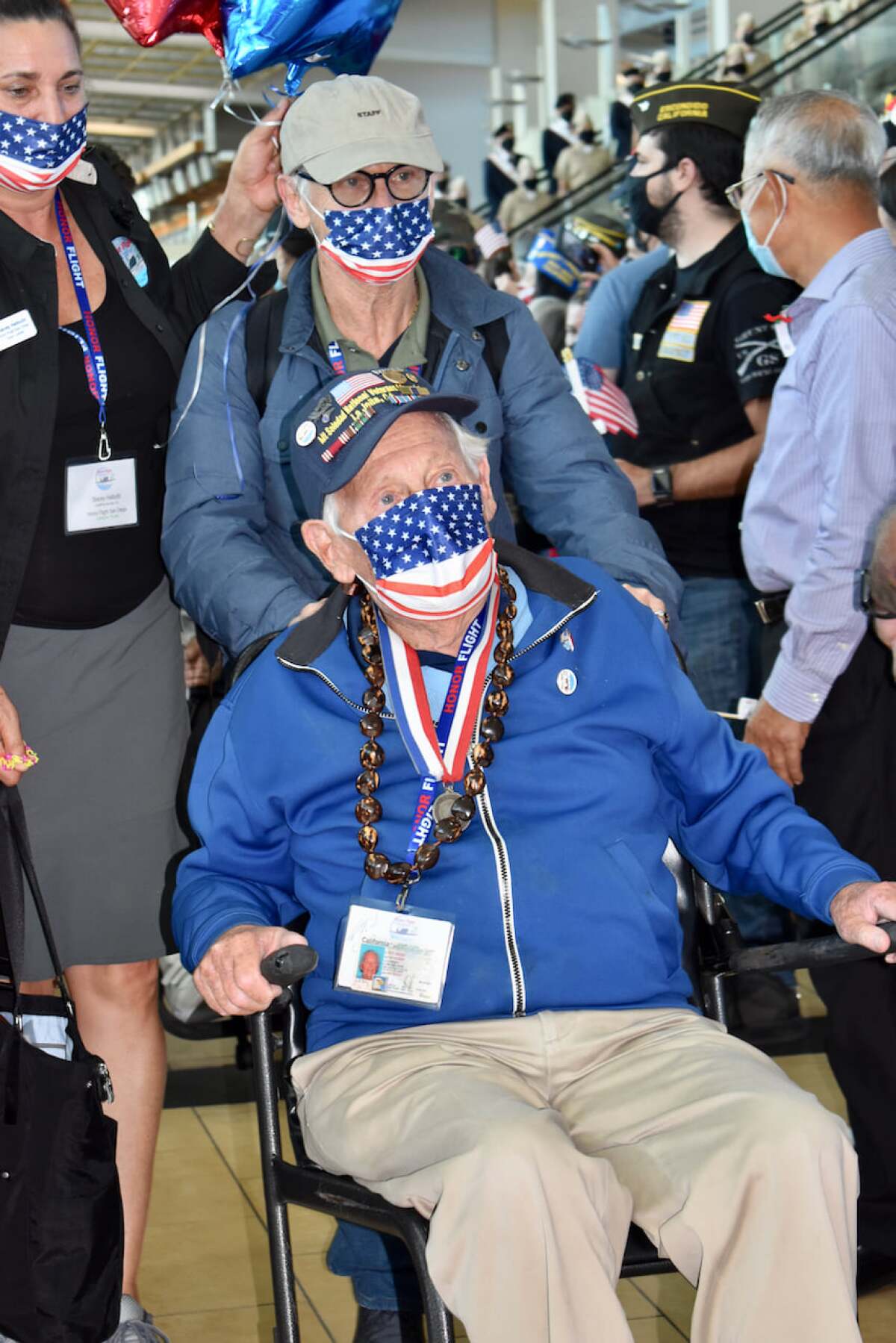 La Jollan Max Gurney (in wheelchair) returns home from an Honor Flight last year.