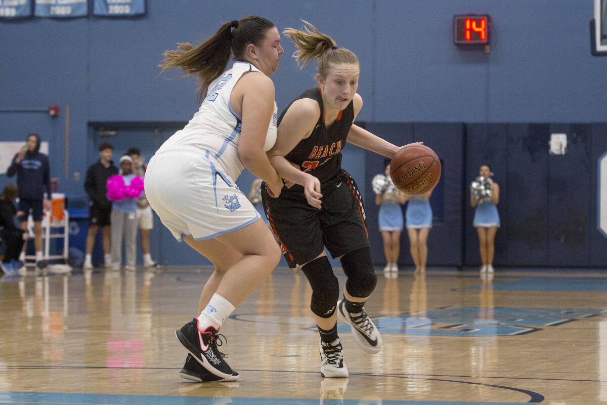 Huntington Beach's Andie Payne, shown dribbling the ball in a Jan. 16 game at Corona del Mar, helped the Oilers rout Los Alamitos 68-32 on Thursday.
