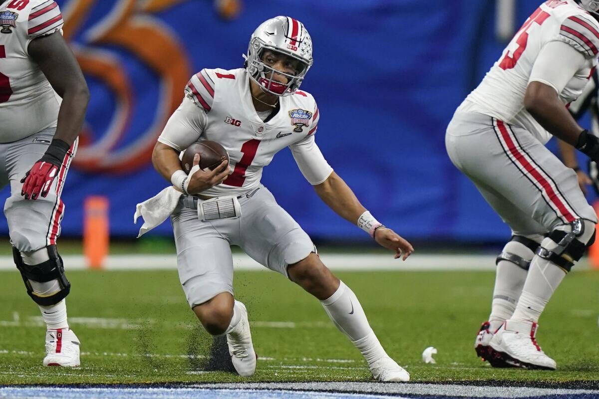 Ohio State quarterback Justin Fields carries the ball during a 49-28 victory over Clemson in the Sugar Bowl.