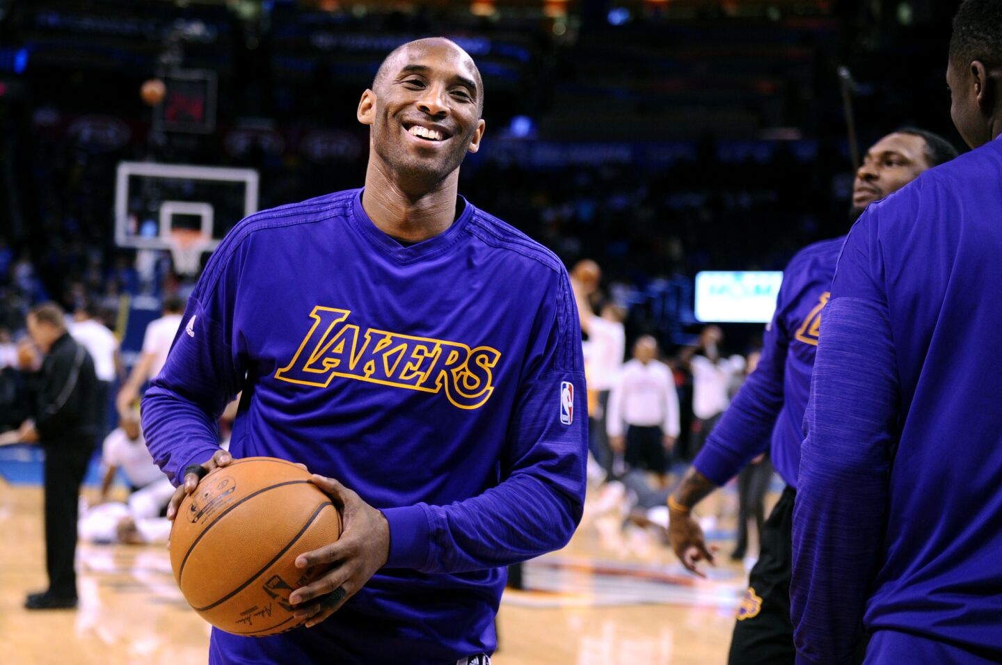 Kobe Bryant laughs with teammates before a game against the Thunder in Oklahoma City on April 11.