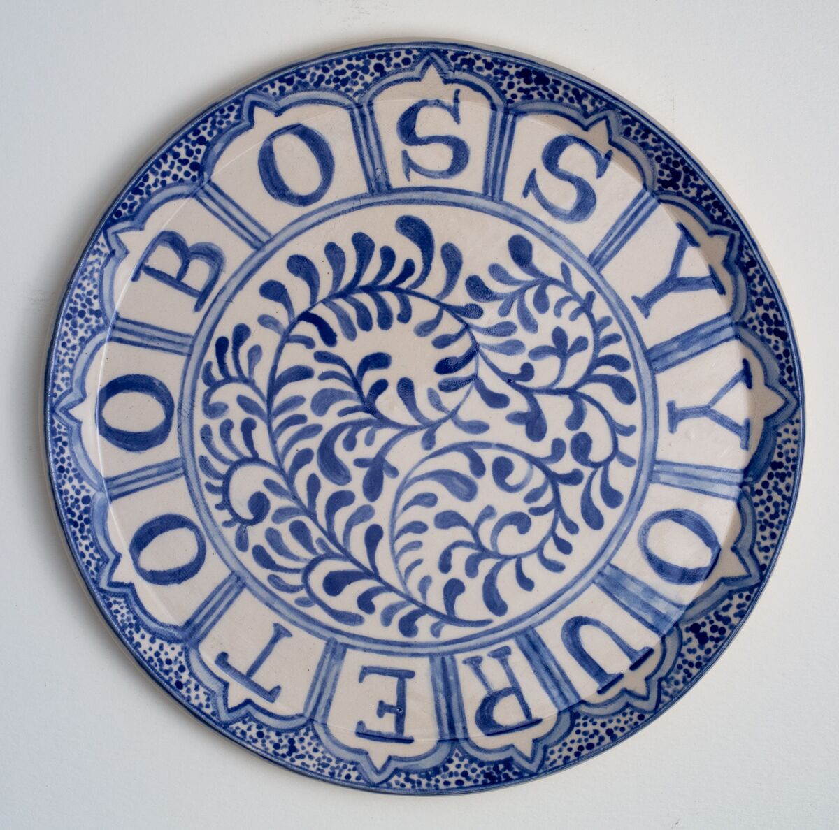 "You're Too Bossy" by Elyse Pignolet, 2019. Ceramic plate with glazes, on view at Track 16.