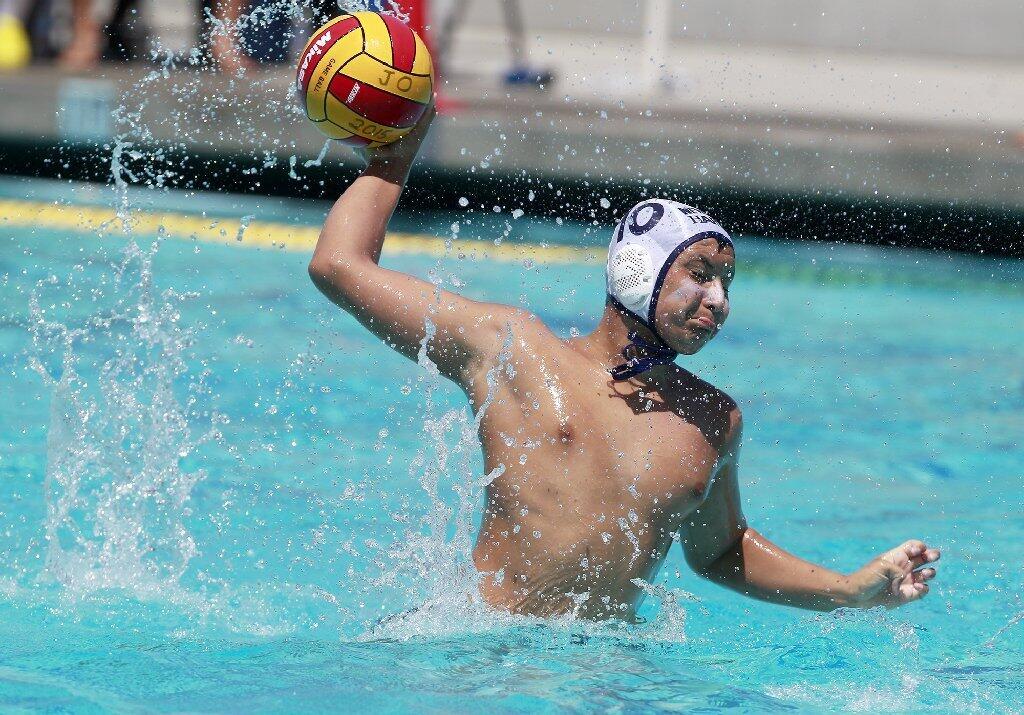 Makoto Kenney of Newport Beach Water Polo attempts to score during the first half against Trojan in the USA Junior Olympics 14U boys' bronze match at the William Woollett Aquatic Center in Irvine on Tuesday.