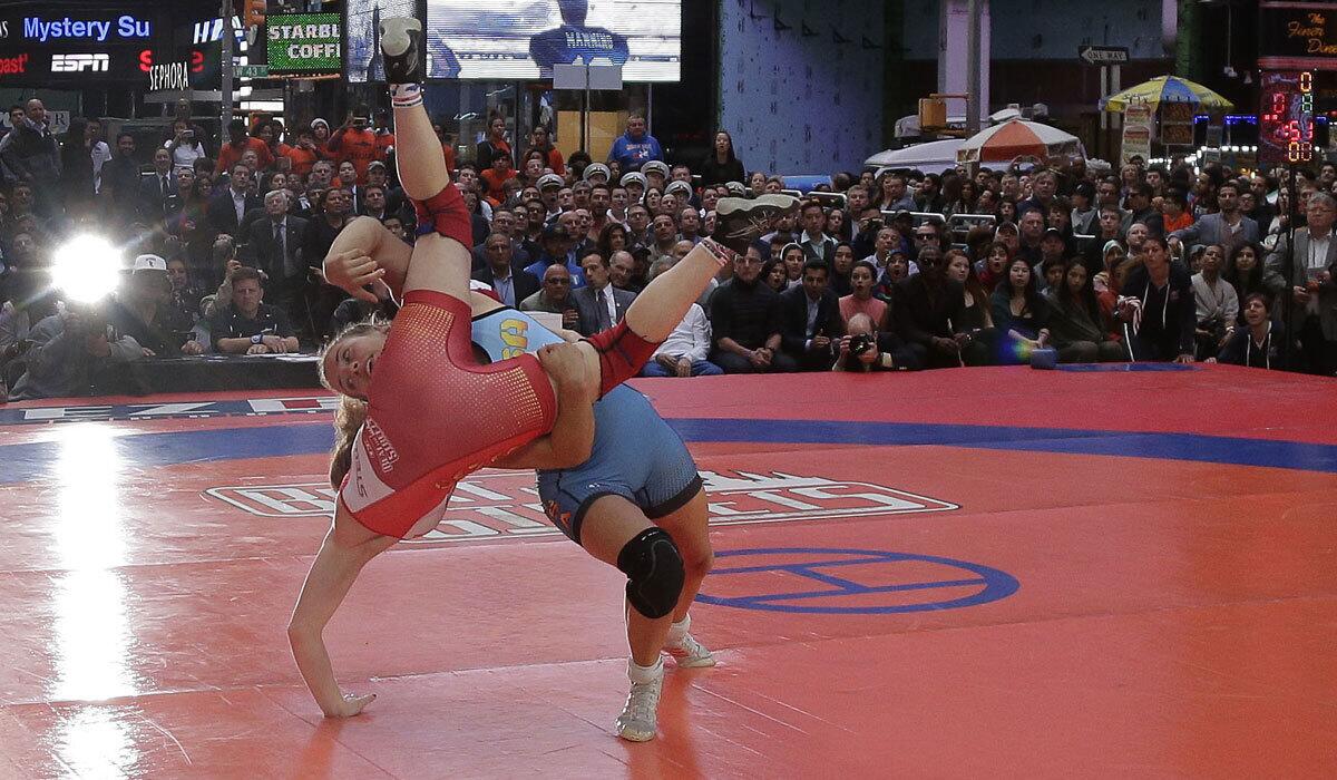 Helen Maroulis, right, takes down Samantha Stewart during the Beat the Streets wresting exhibition in Times Square on May 19.