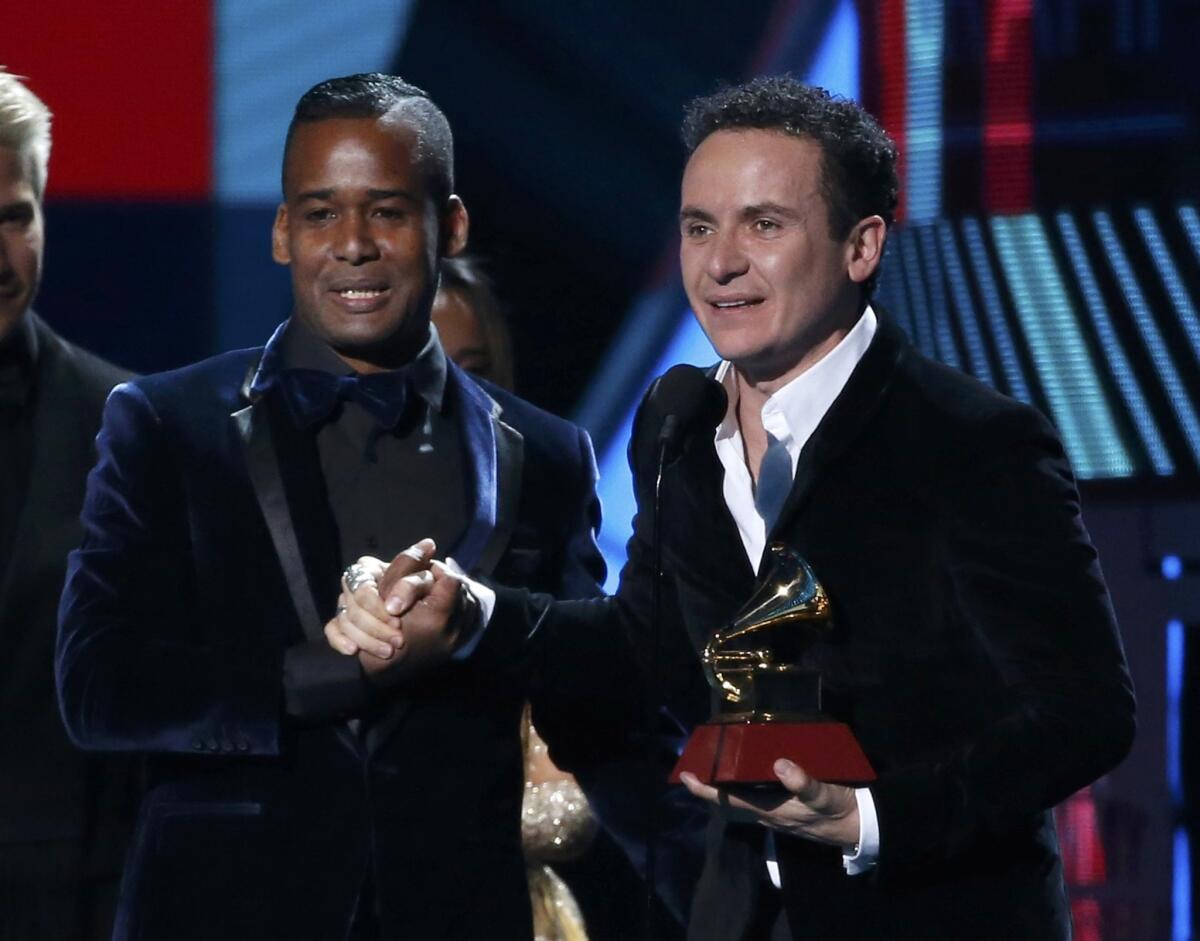 Fonseca (R) accepts the award for best tropical song for "Vine A Buscarte" with Yadam Gonzalez Cardenas at the 17th Annual Latin Grammy Awards in Las Vegas, Nevada, U.S., November 17, 2016. REUTERS/Mario Anzuoni ** Usable by SD ONLY **