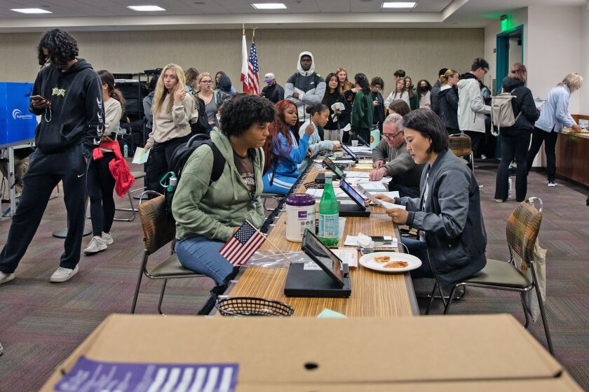 Voters wait in long lines at a vote center in the Conrad Prebys Aztec Student Union at SDSU.