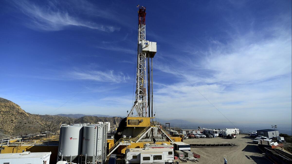 Crews work on a relief well at the Aliso Canyon facility above the Porter Ranch area of Los Angeles on Dec. 9, 2015.