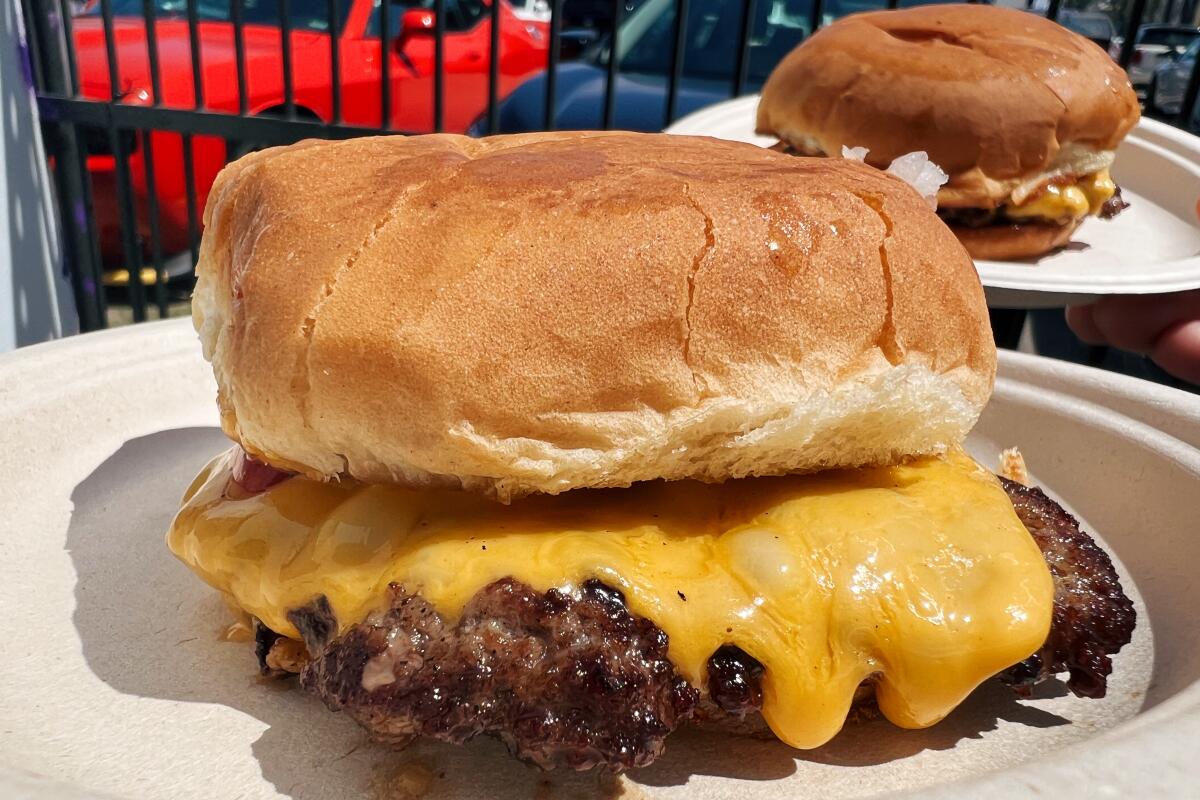 Standing's Butchery on Melrose Avenue in Los Angeles makes cheeseburgers on Sundays in the parking lot behind the shop.
