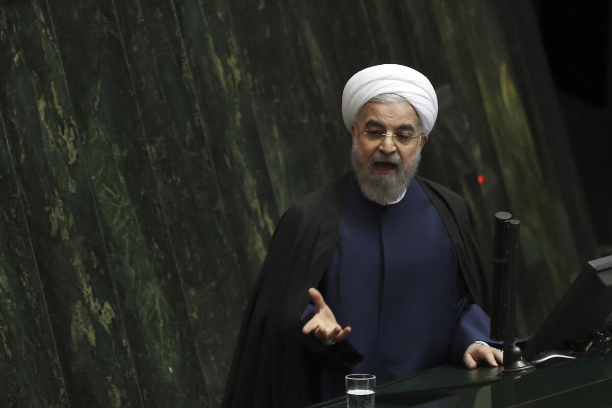 Iranian President Hassan Rouhani, shown speaking before parliament Nov. 18, has vowed to ease international sanctions and improve Iran's economy -- goals dependent on nuclear talks with major powers.