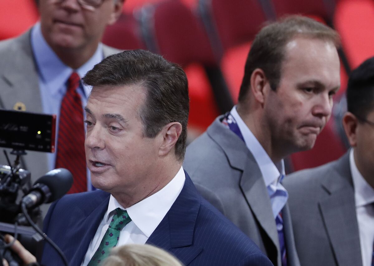 Paul Manafort, left, and his aide Rick Gates on the floor of the Republican National Convention in Cleveland on July 17, 2016.