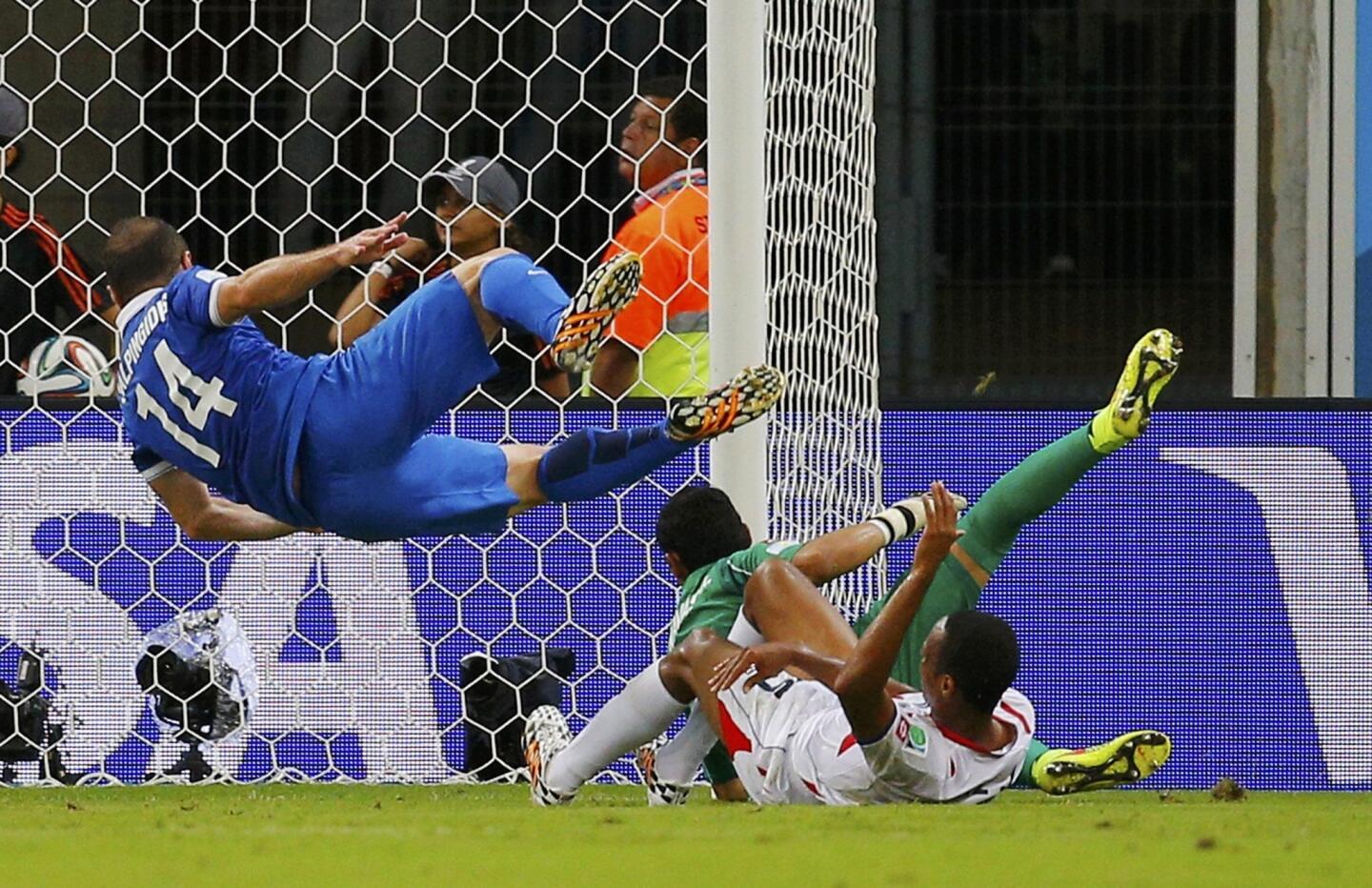 Costa Rica's goalkeeper Navas makes a save on a shot by Greece's Salpingidis during their 2014 World Cup round of 16 game at the Pernambuco arena in Recife