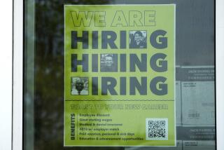 FILE - A hiring sign is displayed at a liquor store in Arlington Heights, Ill., May 21, 2024. (AP Photo/Nam Y. Huh, File)