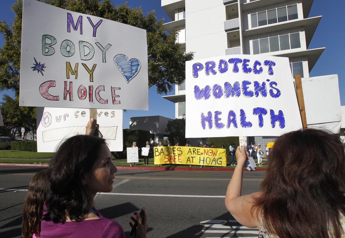 Pro-choice demonstrators protest outside Newport Beach's Hoag Hospital in June over its decision to halt elective abortions. State lawmakers approved a bill Friday that would allow nurse practitioners and other non-physicians to perform first-trimester abortions.