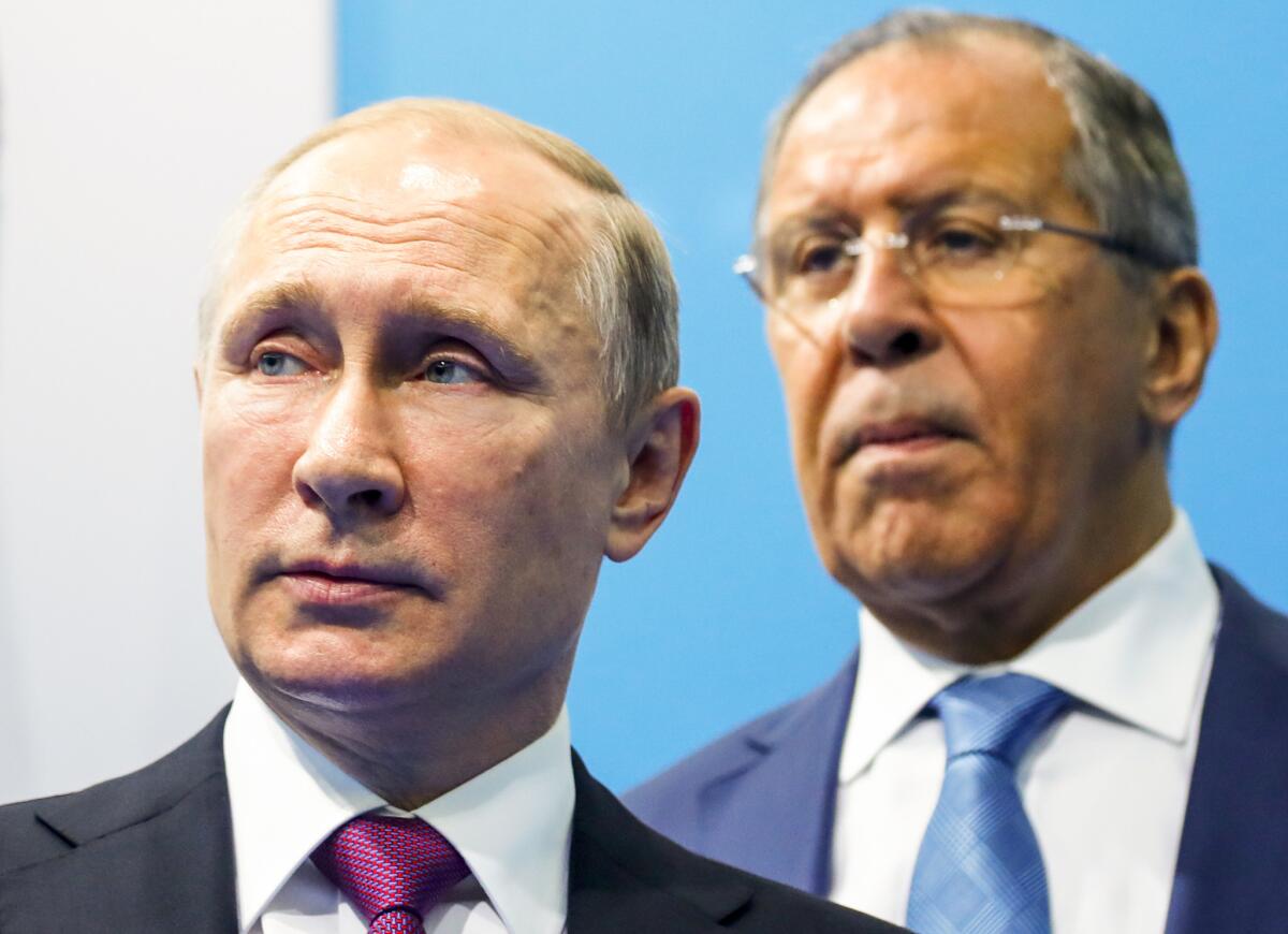 Russian President Vladimir Putin, left, and Foreign Minister Sergei Lavrov at the Group of 20 summit in Hamburg, Germany, on Saturday.