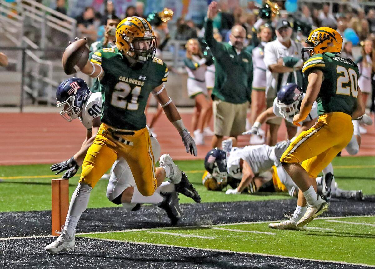 Edison's Troy Fletcher (21) steps into the end zone for a touchdown run against Newport Harbor.