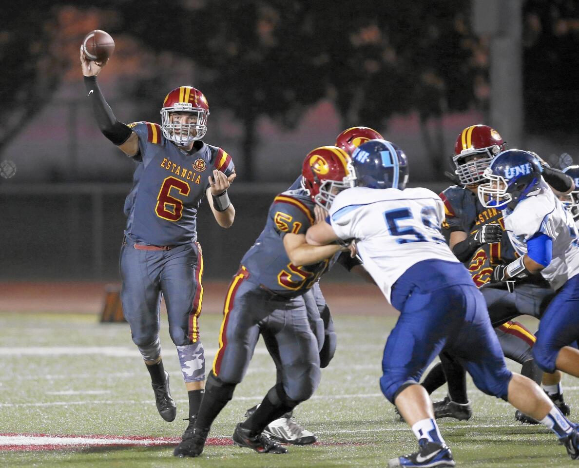 Estancia High quarterback Connor Brown fires a pass against University on Friday.