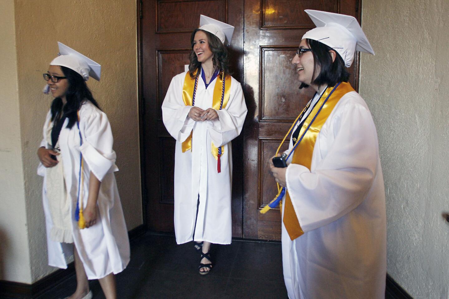 Hoover's An Uong, 17, from left, Ashley mcClure, 18, and Fiona Babakhanians, 18, wait in the auditorium before their graduation ceremony begins, which took place at Hoover High School in Glendale on Thursday, June 14, 2012.