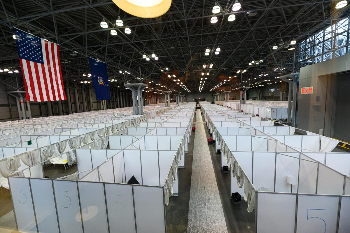 A 3,000-bed temporary hospital for non-coronavirus patients is set up by the Army Corps of Engineers inside the Jacob Javits Convention Center in New York City.