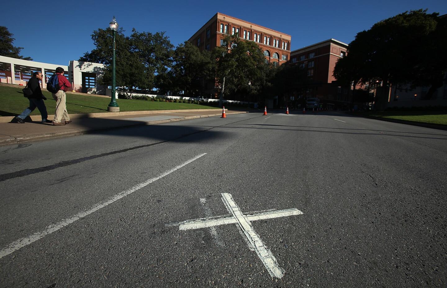 Two Xs on Dealey Plaza mark where where President Kennedy was shot in 1963.