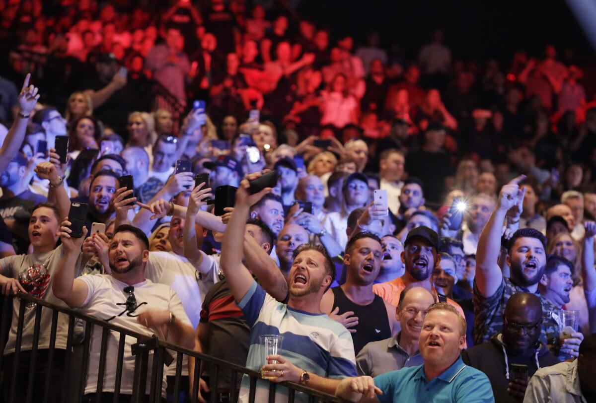 Fans sing during weigh-ins for Deontay Wilder and Tyson Fury ahead of their WBC heavyweight title fight Saturday at the MGM Grand Garden Arena.