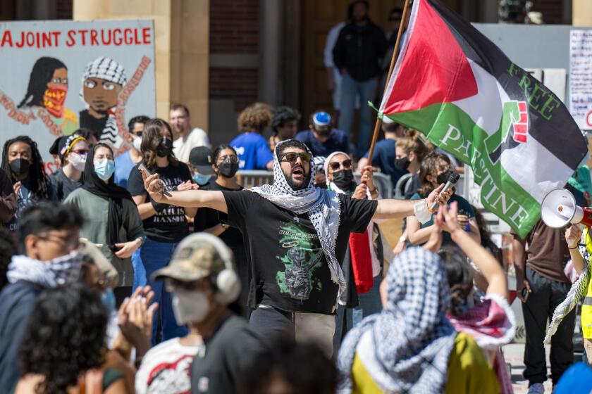 WESTWOOD, CA - April 26, 2024: Pro-Palestinian protesters demonstrate in an encampment at UCLA. (Michael Owen Baker / For The Times)