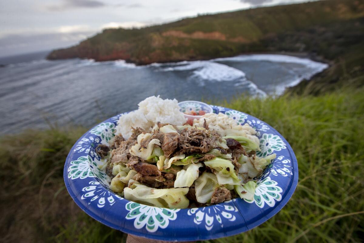 Kalua pork and cabbage, with rice, mac salad and lomi tomato, $12, is on the menu at Joey's Kitchen in Lahaina, Hawaii.