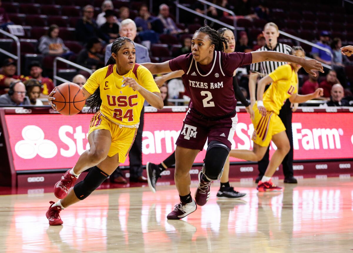 USC's Desiree Caldwell, left, drives past Texas A&M's Aaliyah Wilson on Nov. 23, 2019, at the Galen Center in Los Angeles.