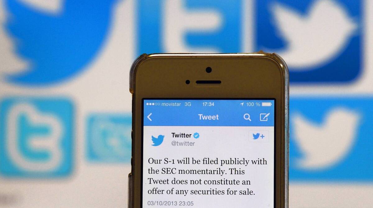 A tweet announcing Twitter's initial public offering (IPO) is pictured on a telephone in Madrid. More than three-quarters of the company's active monthly users are from outside the U.S. With the IPO announcement, pressure will increase for the company to ramp up its global advertising business.
