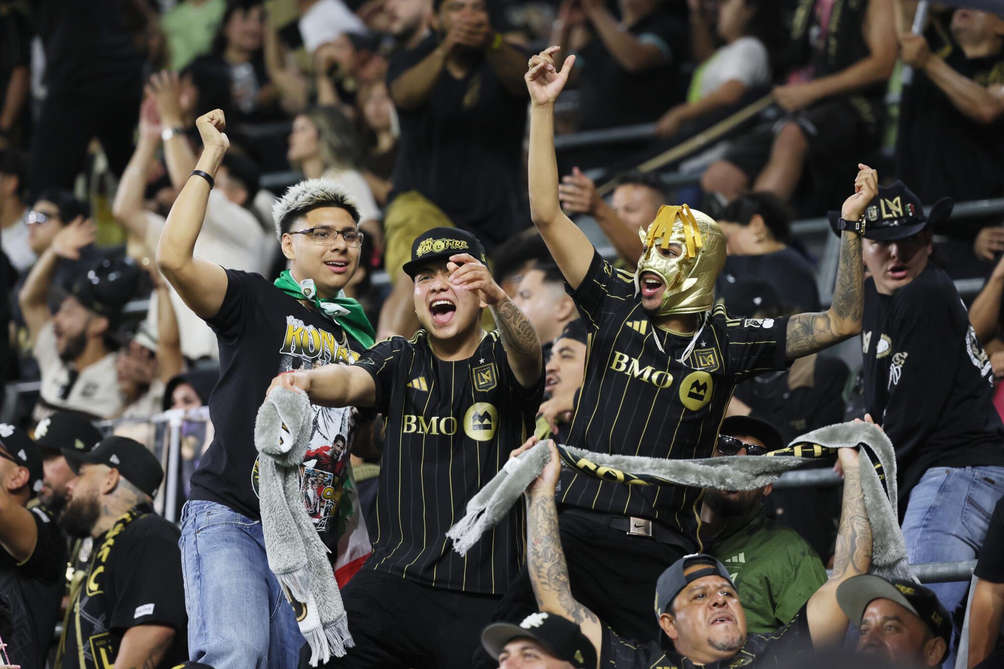 LAFC fans celebrate after their team scored.