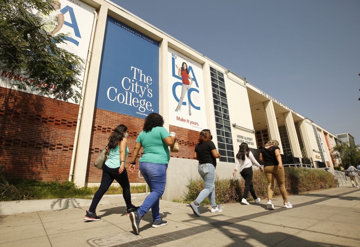 Students walk in front of building