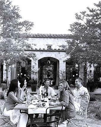 "The French know how to enjoy simple pleasures," says host Gary Simons, center, with his wife Gilena, second from left, and their guest.