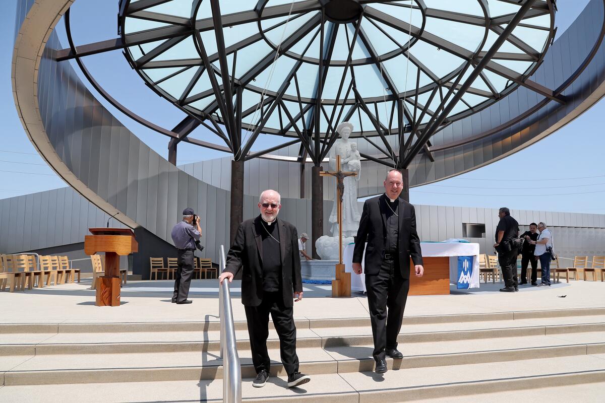 The Most Rev. Kevin Vann, Bishop of the Diocese of Orange, left, and auxiliary bishop Timothy Freyer, right, at the shrine.