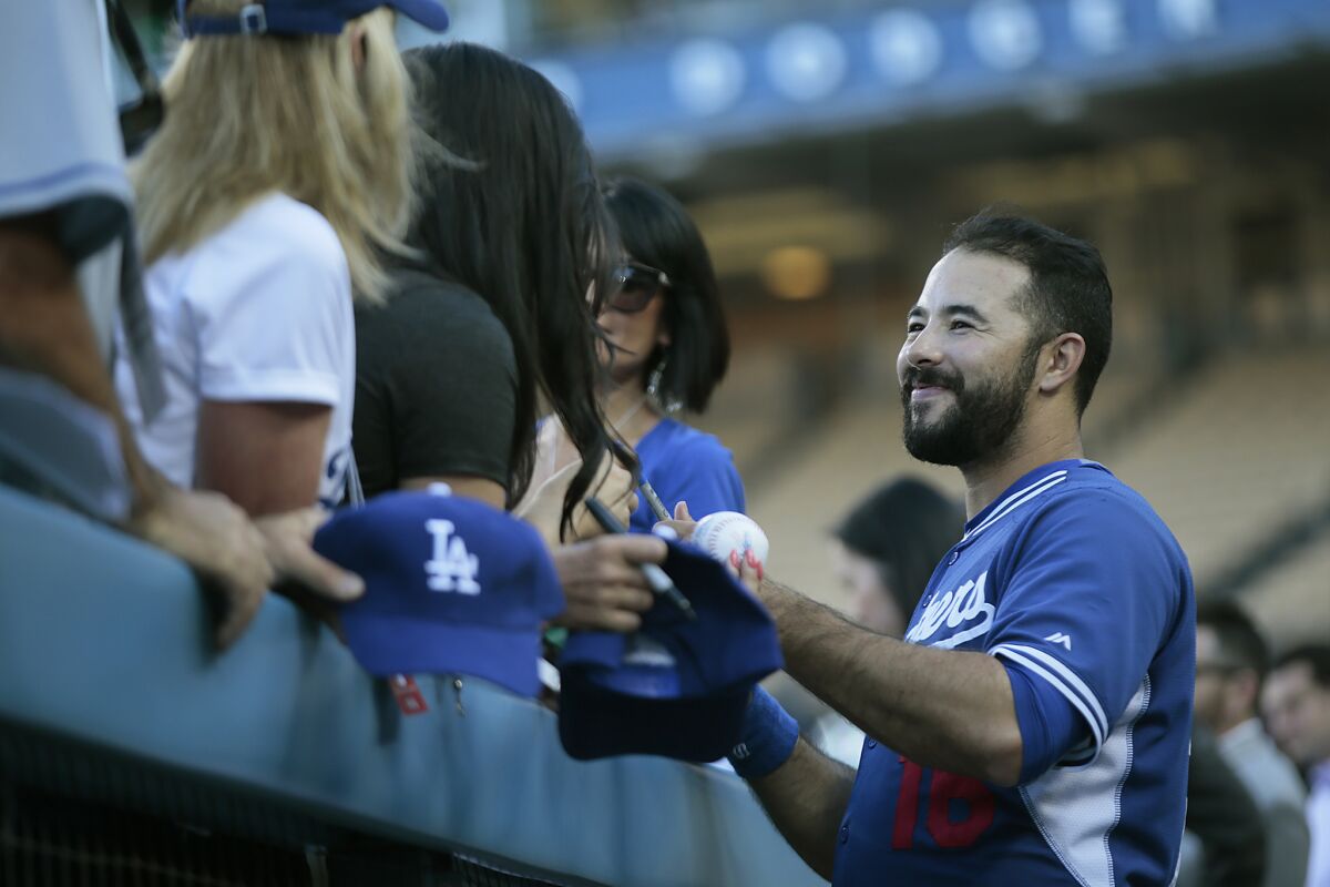 Dodgers outfielder Andre Ethier chats with fans before a game against San Diego at Dodger Stadium on Oct. 2.