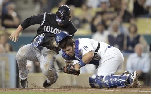 Ian Stewart collids with Dodgers catcher Danny Ardoin in the second inning. Stewart was out on the play.
