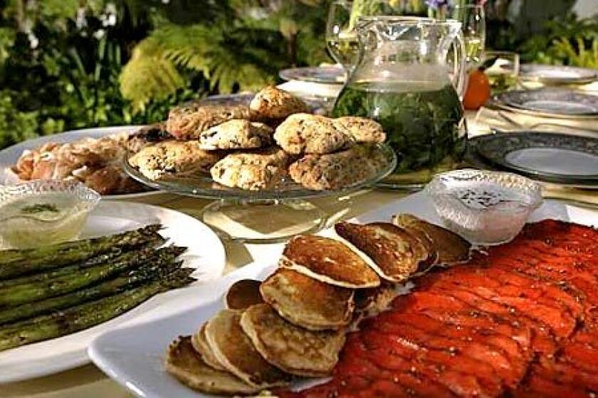 A FRESH TABLE: Chocolate-orange scones, a pitcher of tisane, leek pancakes and fennel-aquavit gravlax with caraway crème fraîche.
