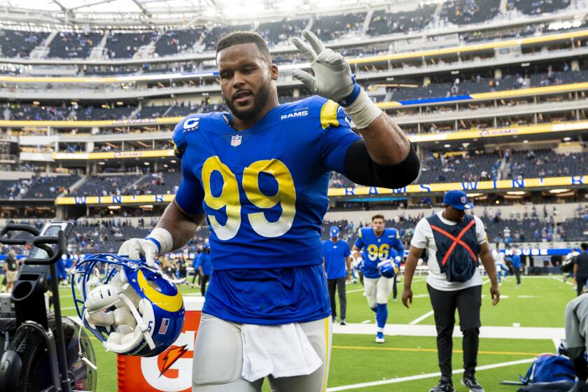 Los Angeles Rams defensive end Aaron Donald (99) walks back to the locker room after the team defeats the Detroit Lions in an NFL football game Sunday, Oct. 24, 2021, in Inglewood, Calif. (AP Photo/Kyusung Gong)