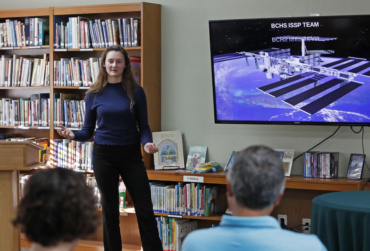 Brethren Christian High School junior Paige Coultrup, 16, speaks during a presentation Thursday about the school's experiment this year aboard the International Space Station.