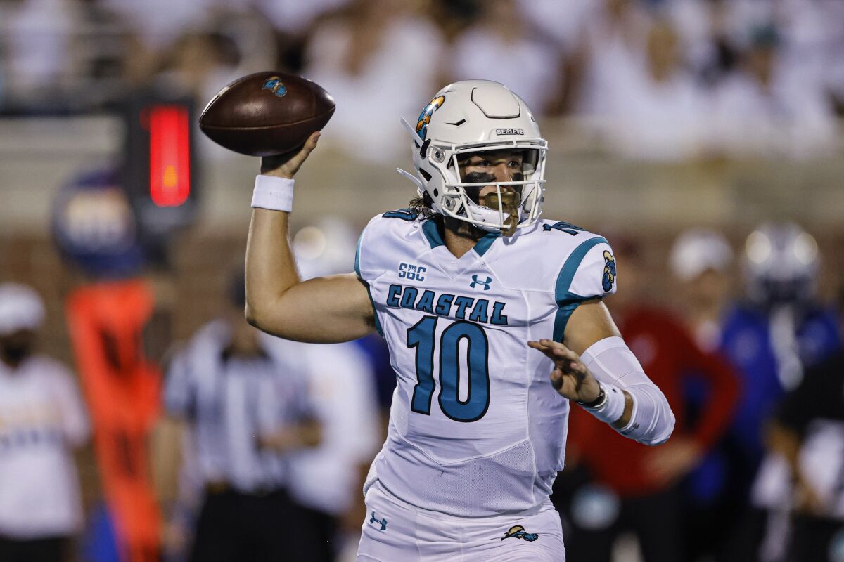 Coastal Carolina quarterback Grayson McCall prepares to throw a pass against Kansas during the first half of an NCAA college football game in Conway, S.C., Friday, Sept. 10, 2021. (AP Photo/Nell Redmond)