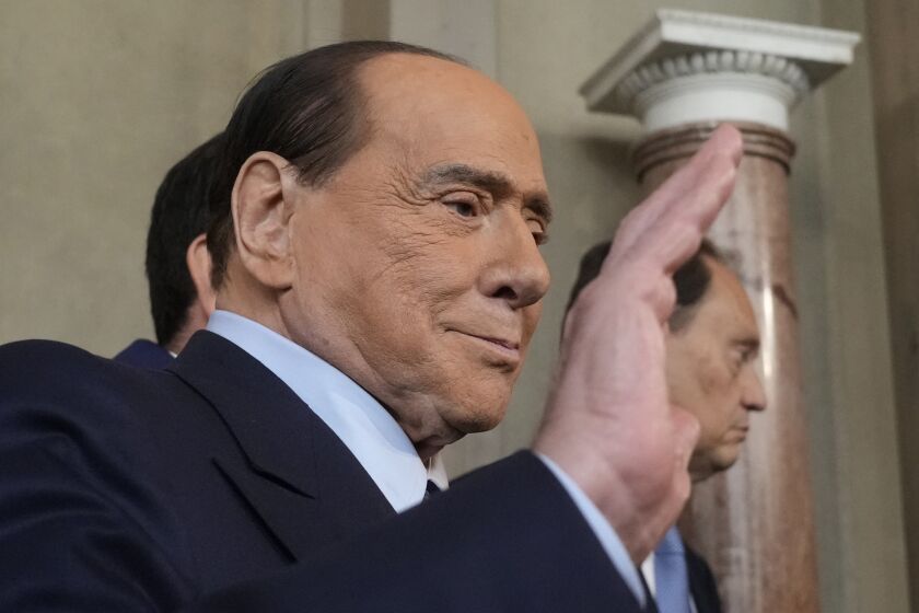FILE - Forza Italia president Silvio Berlusconi waves to the press as he leaves the Quirinale Presidential Palace in Rome, on Oct. 21, 2022. Former Italian Premier Silvio Berlusconi has been admitted to a Milan hospital where he spent 45 days this spring being treated for a lung infection and chronic leukemia, Italian media reported Friday, June 9, 2023. (AP Photo/Gregorio Borgia, File)