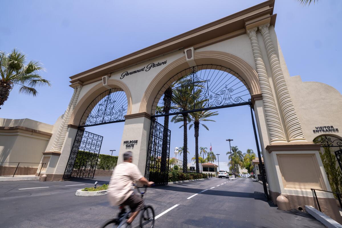A cyclist heads into the Paramount lot.